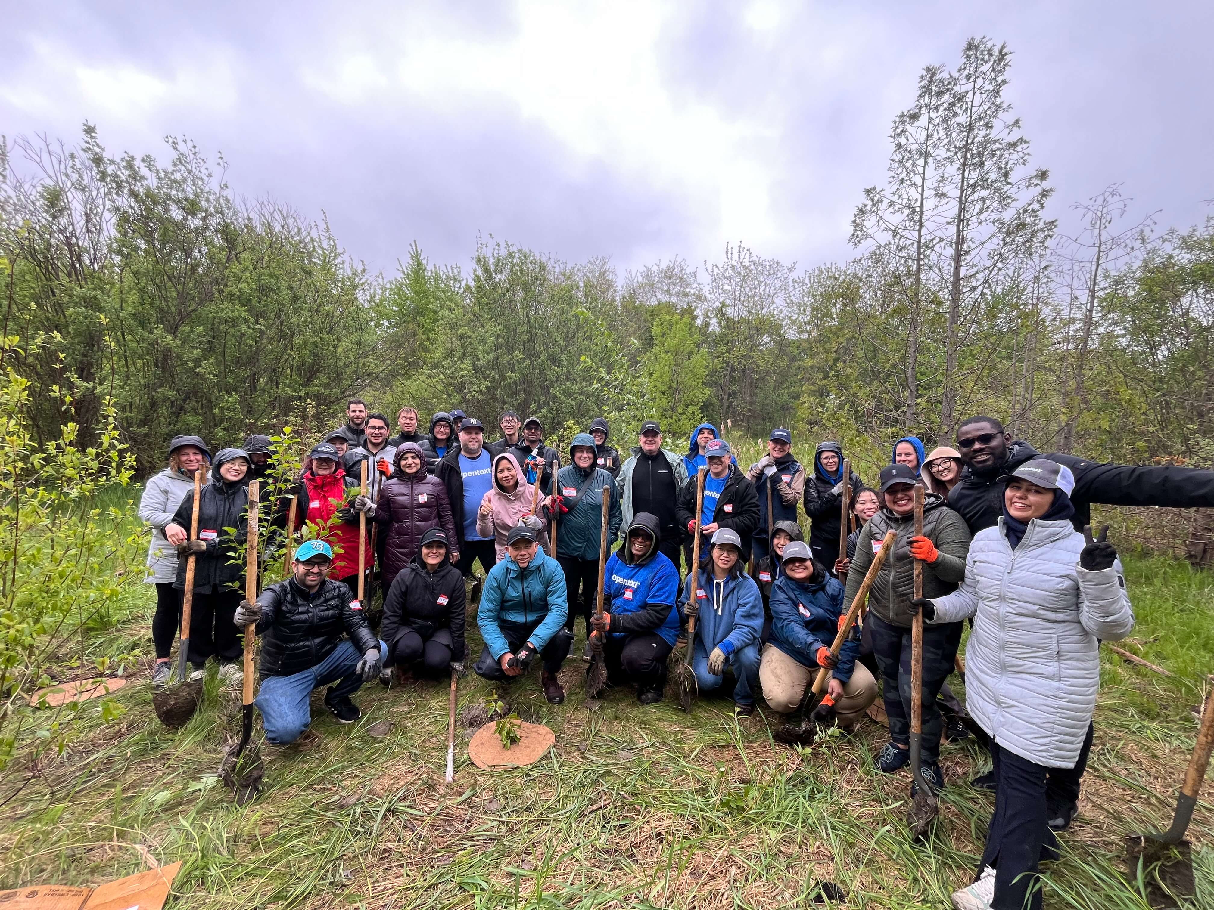 OpenText employees tree planting in Richmond Hill