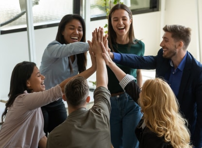 6 co-workers doing high-fives