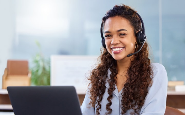 A person smiling in an office