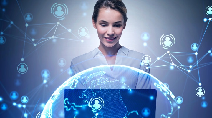 Woman smiling in front of computer