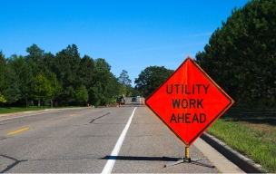 Construction sign indicating utility work ahead