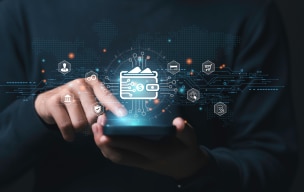 A person using their phone with a digital wallet icon