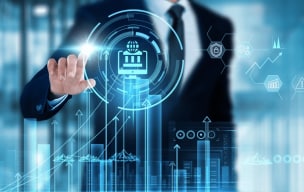 A person wearing a suit working on a holographic screen