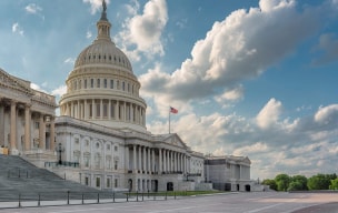 A picture of a big government building with and a cloudy sky