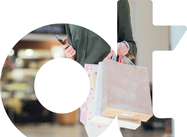 OpenText OT watermark image with person shopping while using their phone