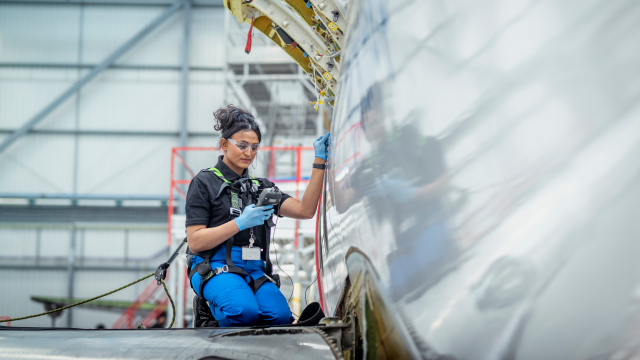 Person checking aircraft