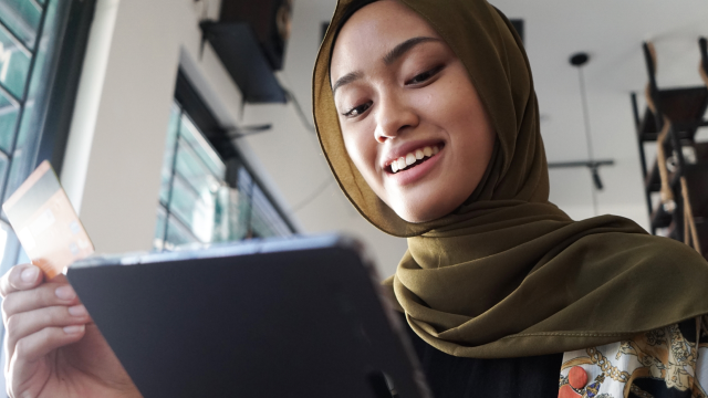 A person holding a tablet