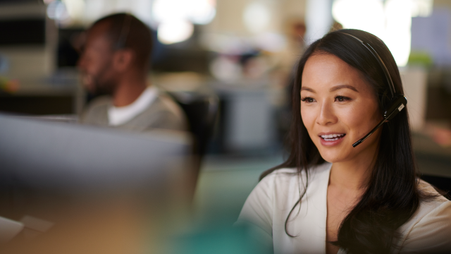 Smiling human resources representative working at her desk