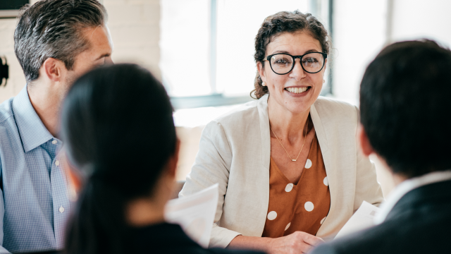 Four people having a meeting