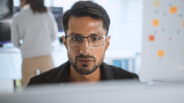 A person looking at a laptop