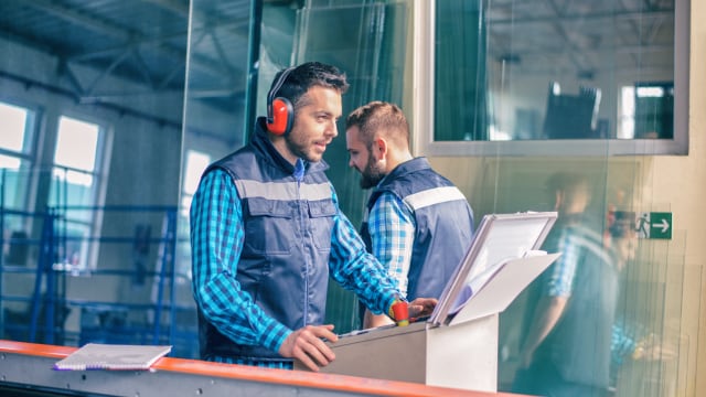 Two person working on construction site 