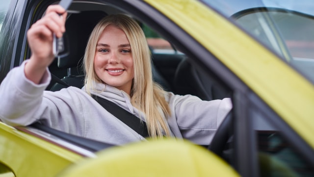 A girl driving a car