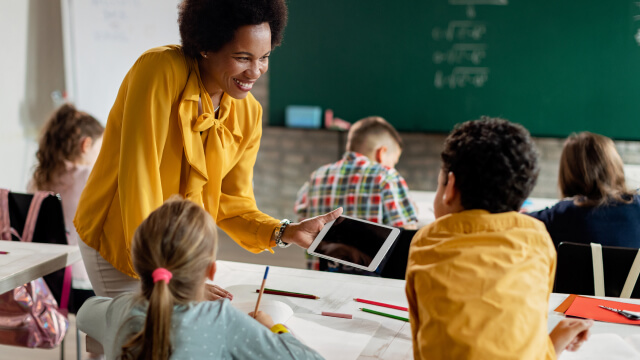 A person teaching to students in classroom
