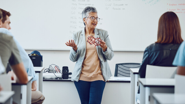 A person taking lecture to students