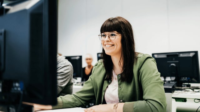 person working on a computer in a classroom