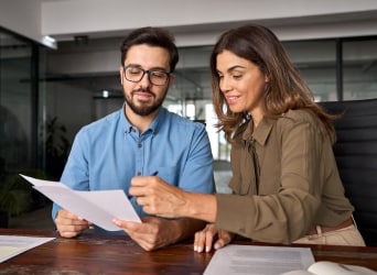 Two people reviewing a document