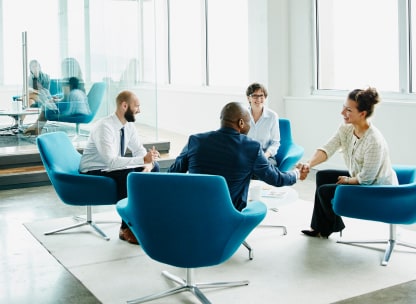 A roundtable meeting of four people