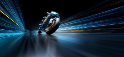 A futuristic motorcycle speeding forward, with motion blur and light trails suggesting high speed